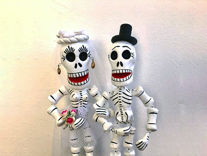 Two skeleton figures. Photo.